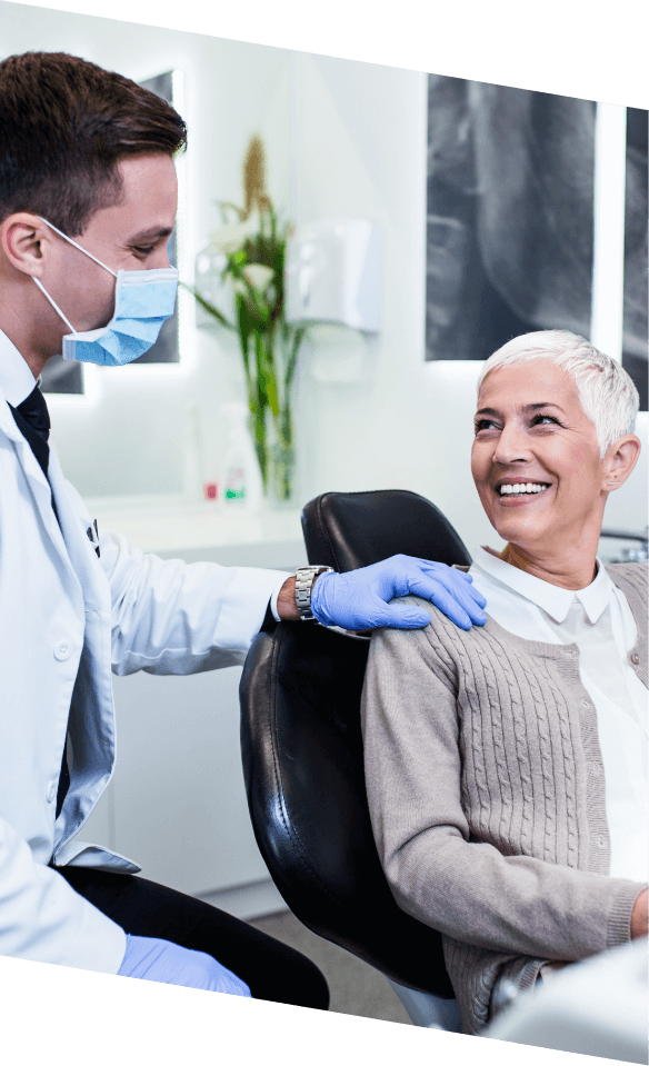 Castle Rock dentist placing their hand on shoulder of patient in dental chair