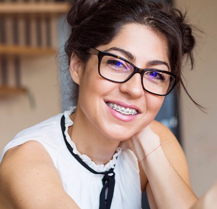 Patient wearing traditional braces from professional