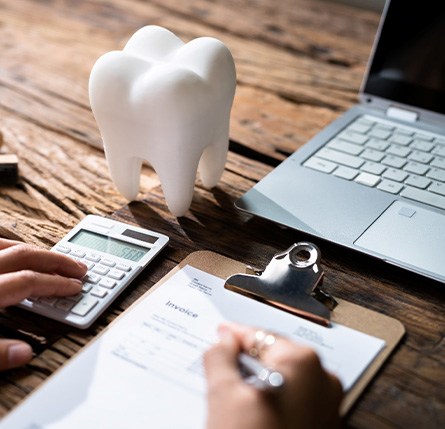 Person figuring out cost of traditional braces