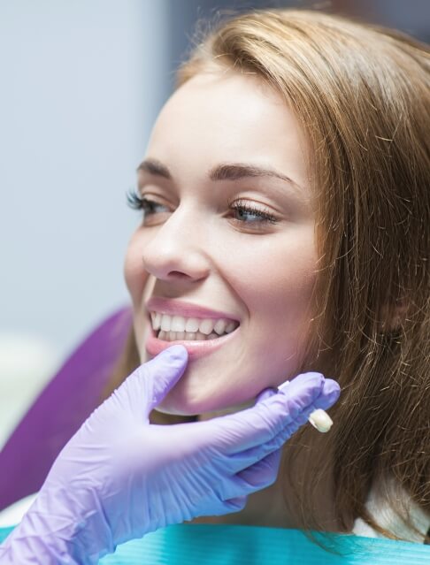 Young woman smiling at her dentist