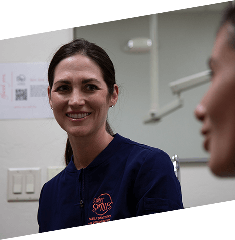 Dental team member smiling at a patient