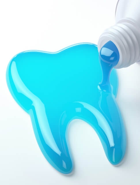 Blue toothpaste coming out of tube in shape of tooth