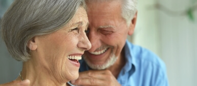 Senior man and woman laughing together