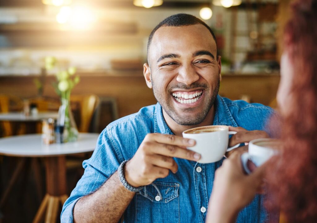 A man drinking a cup of coffee